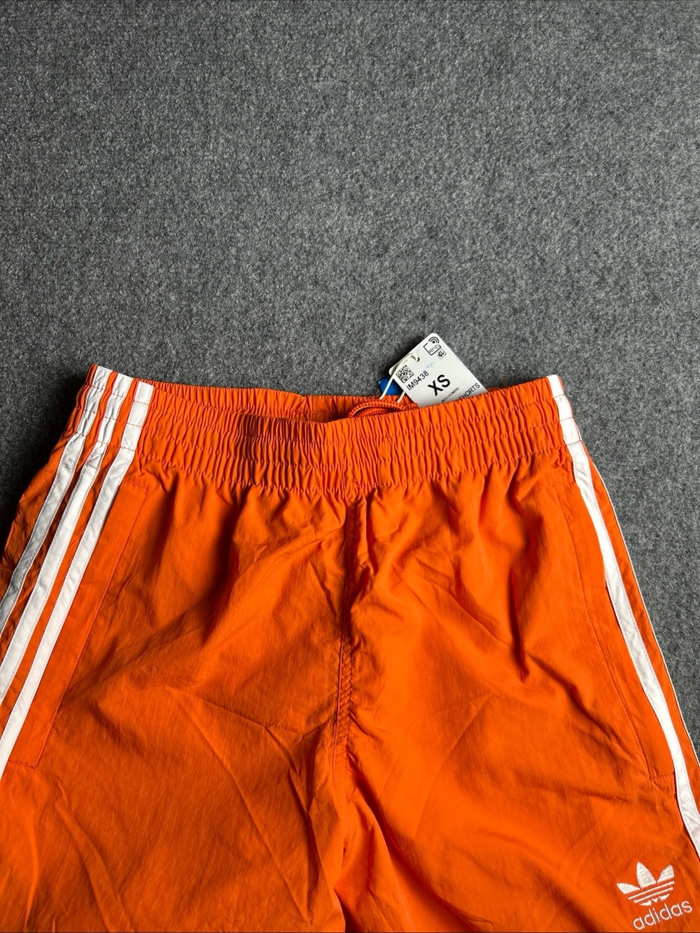 adidas Men’s Orange Athletic Shorts with White Stripes